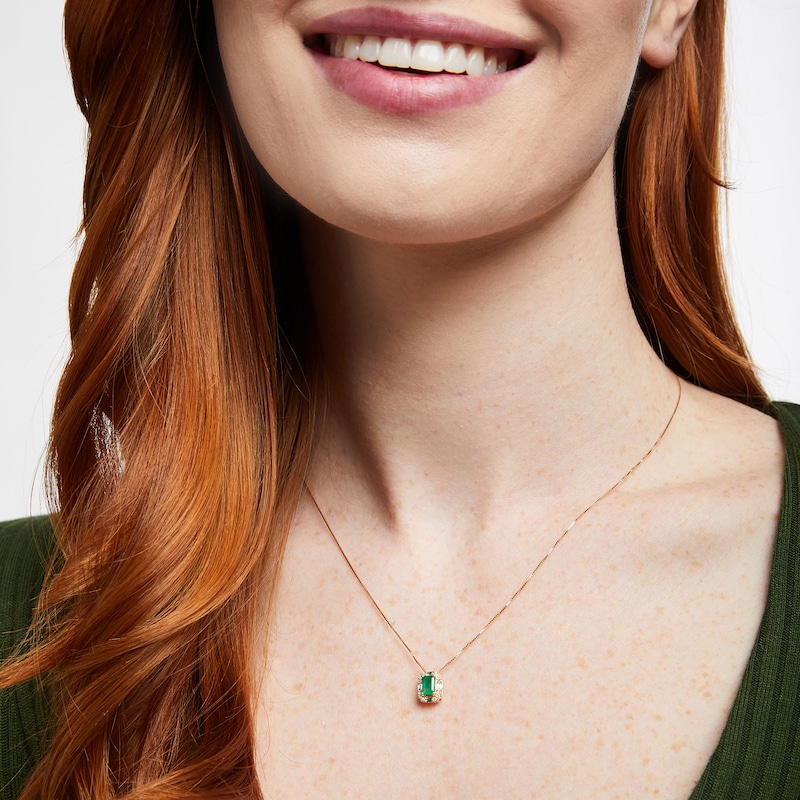 Main Image 2 of Emerald-Cut Emerald and 1/8 CT. T.W. Baguette and Round Diamond Frame Pendant in 10K Gold