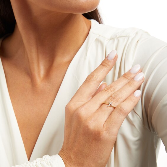 1/20 CT. T.w. Diamond Bypass Cross Ring in 10K Gold