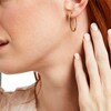 Thumbnail Image 1 of 1/2 CT. T.W. Diamond Oval Hoop Earrings in 14K Gold