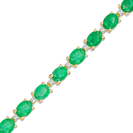 Oval Emerald and 1/6 CT. T.w. Diamond Alternating Line Bracelet in 10K Gold