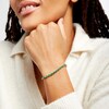 Thumbnail Image 2 of Oval Emerald and 1/6 CT. T.W. Diamond Alternating Line Bracelet in 10K Gold
