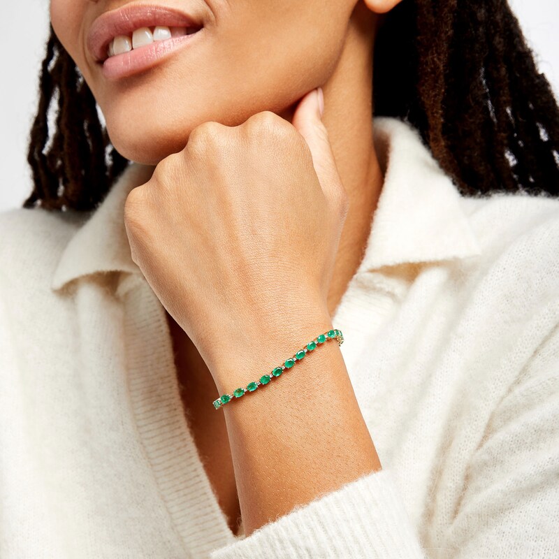 Main Image 2 of Oval Emerald and 1/6 CT. T.W. Diamond Alternating Line Bracelet in 10K Gold