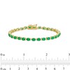 Thumbnail Image 4 of Oval Emerald and 1/6 CT. T.W. Diamond Alternating Line Bracelet in 10K Gold