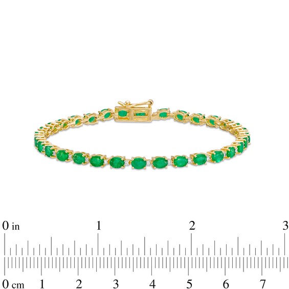 Oval Emerald and 1/6 CT. T.w. Diamond Alternating Line Bracelet in 10K Gold