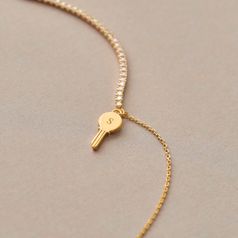 Main Image 8 of PDPAOLA™ at Zales Cubic Zirconia Dangle Key Bracelet in Sterling Silver with 18K Gold Plate – 7.28"