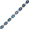 Thumbnail Image 1 of Oval Blue Sapphire and 1/6 CT. T.W. Diamond Alternating Line Bracelet in 10K Gold