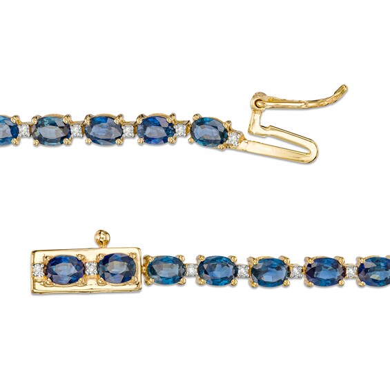 Oval Blue Sapphire and 1/6 CT. T.w. Diamond Alternating Line Bracelet in 10K Gold