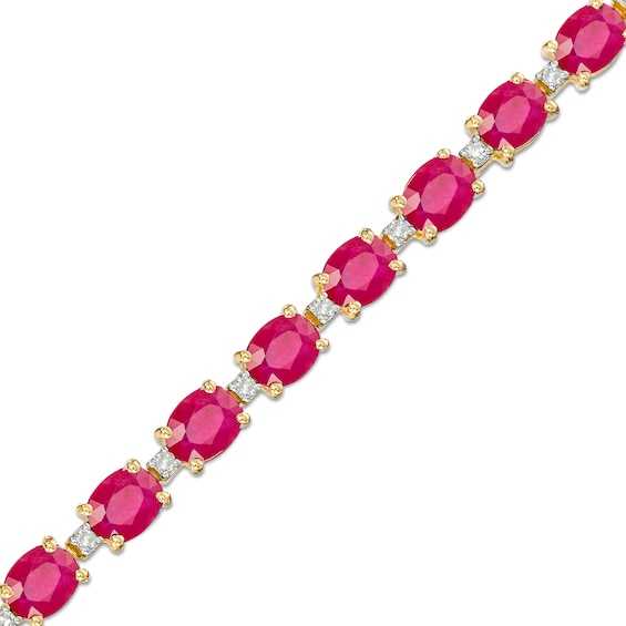 Oval Ruby and 1/6 CT. T.w. Diamond Alternating Line Bracelet in 10K Gold