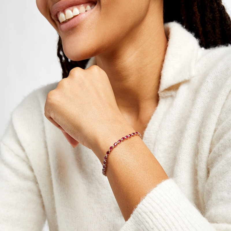 Main Image 2 of Oval Ruby and 1/6 CT. T.W. Diamond Alternating Line Bracelet in 10K Gold