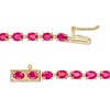Thumbnail Image 3 of Oval Ruby and 1/6 CT. T.W. Diamond Alternating Line Bracelet in 10K Gold