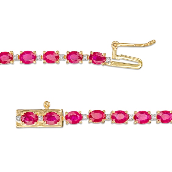 Oval Ruby and 1/6 CT. T.w. Diamond Alternating Line Bracelet in 10K Gold