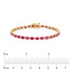 Thumbnail Image 4 of Oval Ruby and 1/6 CT. T.W. Diamond Alternating Line Bracelet in 10K Gold