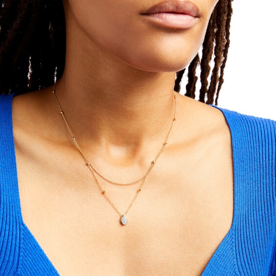 1/6 CT. T.w. Pear-Shaped Multi-Diamond Double Strand Bead Station Necklace in 10K Gold - 16.5"