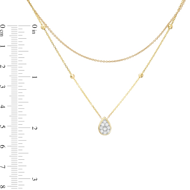 1/6 CT. T.W. Pear-Shaped Multi-Diamond Double Strand Bead Station Necklace in 10K Gold - 16.5"