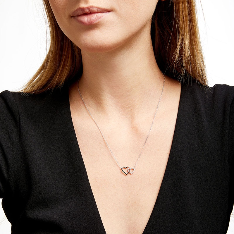 Main Image 2 of 1/5 CT. T.W. Black and White Diamond Interlocking Hearts Necklace in 10K White Gold