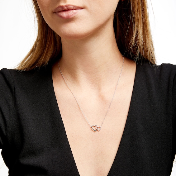1/5 CT. T.w. Black and White Diamond Interlocking Hearts Necklace in 10K White Gold