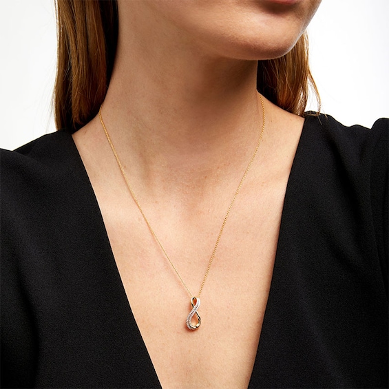 1/8 CT. T.w. Diamond Double Row Infinity Pendant in 10K Gold