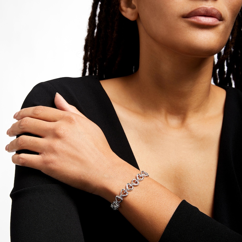 Main Image 2 of 1/5 CT. T.W. Diamond Heart Link Line Bracelet in Sterling Silver – 7.25"