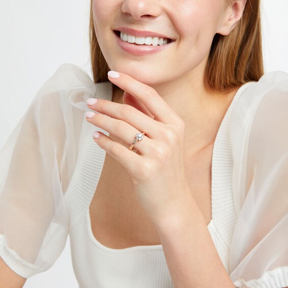 1/2 CT. T.w. Diamond Sunburst Channel-Set Shank Engagement Ring in 10K Rose Gold (J/I3)