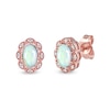 Thumbnail Image 1 of Oval Opal and 1/20 CT. T.W. Diamond Scallop Frame Art Deco Stud Earrings in 10K Rose Gold