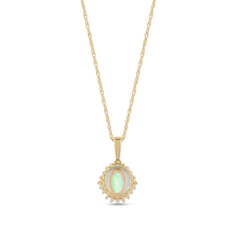Main Image 3 of Oval Opal and 1/8 CT. T.W. Baguette and Round Diamond Starburst Frame Pendant in 10K Gold