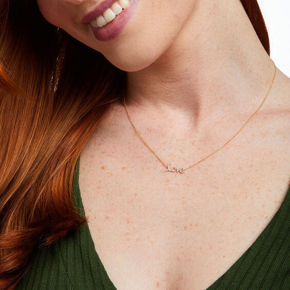 Love Talks 1/10 CT. T.w. Diamond "love" Cursive Script Necklace in 10K Gold