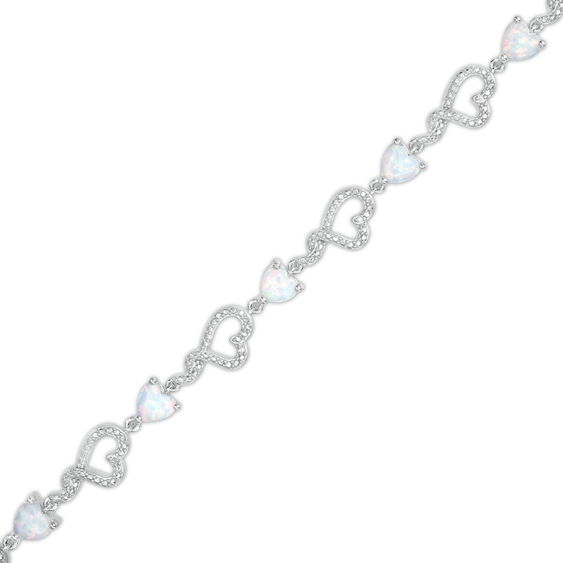 5.0mm Heart-Shaped Lab-Created Opal and Diamond Accent Beaded Abstract Ribbon Heart Bracelet in Sterling Silver - 7.25"
