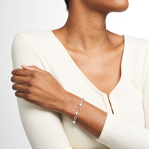 5.0mm Heart-Shaped Lab-Created Opal and Diamond Accent Beaded Abstract Ribbon Heart Bracelet in Sterling Silver - 7.25"
