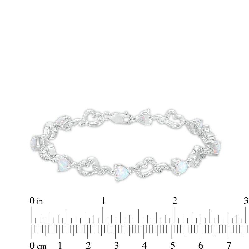 5.0mm Heart-Shaped Lab-Created Opal and Diamond Accent Beaded Abstract Ribbon Heart Bracelet in Sterling Silver - 7.25"