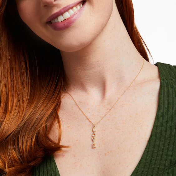 Love Talks 1/6 CT. T.w. "Love" Vertical Drop Pendant in 10K Gold