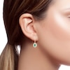 Thumbnail Image 1 of Oval Emerald and 3/8 CT. T.W. Diamond Double Frame Drop Earrings in 14K Gold