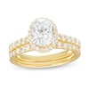 Thumbnail Image 0 of 1-3/4 CT. T.W. Certified Oval Lab-Created Diamond Frame Bridal Set in 14K Gold (I/SI2)