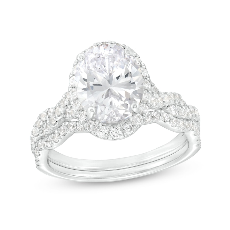 Main Image 1 of 2-5/8 CT. T.W. Certified Oval Lab-Grown Diamond Frame Twist Shank Bridal Set in 14K White Gold (I/SI2)