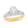 Thumbnail Image 1 of 1-1/4 CT. T.W. Oval Diamond Frame Split Shank Bridal Set in 14K Gold