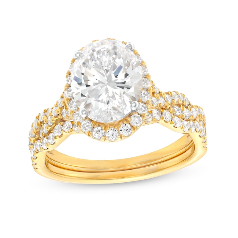 Main Image 1 of 2-5/8 CT. T.W. Certified Oval Lab-Grown Diamond Frame Twist Shank Bridal Set in 14K Gold (I/SI2)