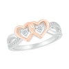 Thumbnail Image 1 of 1/8 CT. T.W. Diamond Interlocking Hearts Split Shank Promise Ring in Sterling Silver and 14K Rose Gold Plate