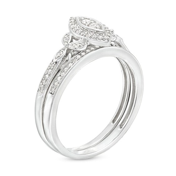1/4 CT. T.w. Marquise-Shaped Multi-Diamond Frame Leaf-Sides Ribbon Shank Bridal Set in Sterling Silver