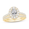 Thumbnail Image 1 of Celebration Ideal 1-1/2 CT. T.W. Oval Certified Diamond Frame Split Shank Bridal Set in 14K Gold (I/I1)