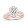 Thumbnail Image 1 of Celebration Ideal 1-1/2 CT. T.W. Oval Certified Diamond Frame Split Shank Bridal Set in 14K Rose Gold (I/I1)