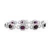 Thumbnail Image 1 of Oval Garnet and 1/20 CT. T.W. Diamond Beaded Buckle-Style Line Bracelet in Sterling Silver - 7.5"