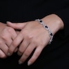 Thumbnail Image 2 of Oval Garnet and 1/20 CT. T.W. Diamond Beaded Buckle-Style Line Bracelet in Sterling Silver - 7.5"