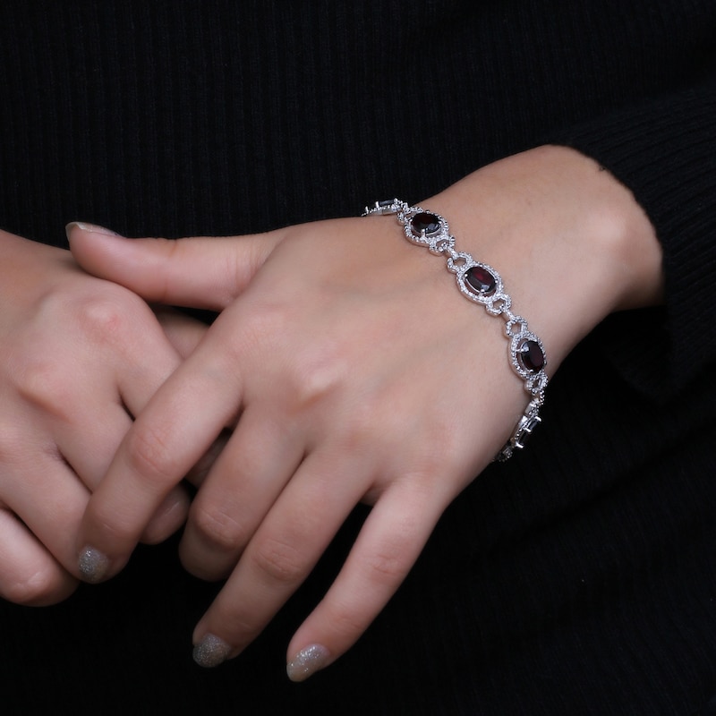 Main Image 2 of Oval Garnet and 1/20 CT. T.W. Diamond Beaded Buckle-Style Line Bracelet in Sterling Silver - 7.5"