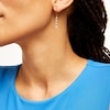 Thumbnail Image 2 of 1/2 CT. T.W. Multi-Diamond Graduated Flower Drop Earrings in 10K Gold