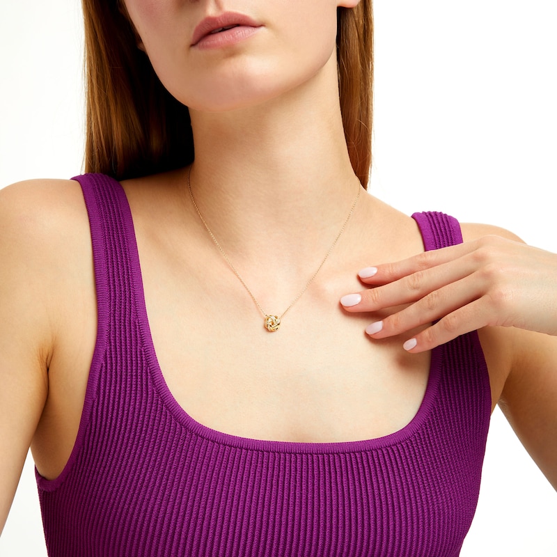 Main Image 2 of 1/10 CT. T.W. Diamond Love Knot Necklace in 10K Gold - 17"