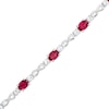 Thumbnail Image 1 of Oval Lab-Created Ruby and White Lab-Created Sapphire Alternating Infinity Line Bracelet in Sterling Silver - 7.25&quot;