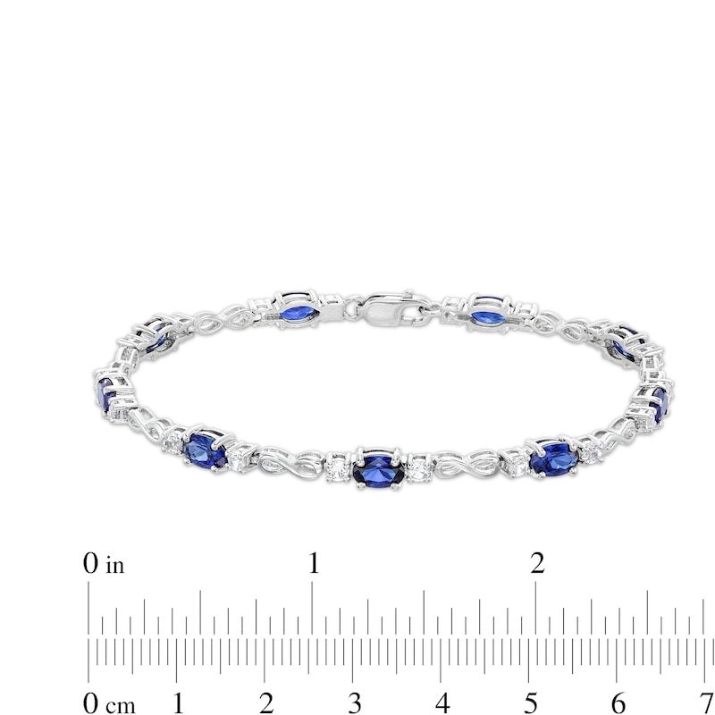 Main Image 4 of Oval Blue and White Lab-Created Sapphire Alternating Infinity Line Bracelet in Sterling Silver - 7.25"