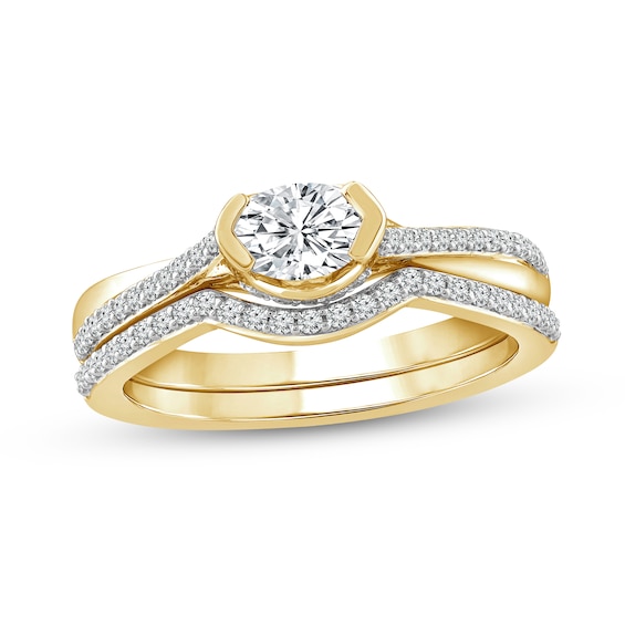 3/4 CT. T.w. Oval Diamond Sideways Bridal Set in 10K Gold