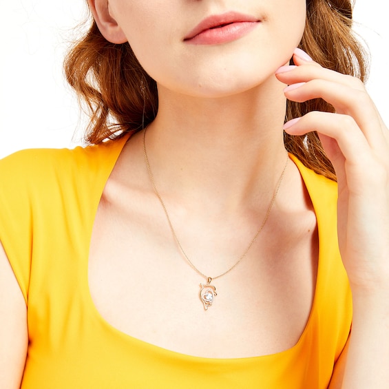 Heart-Shaped Blue Topaz and 1/10 CT. T.w. Diamond Dolphin Calf Pendant in Sterling Silver with 14K Gold Plate
