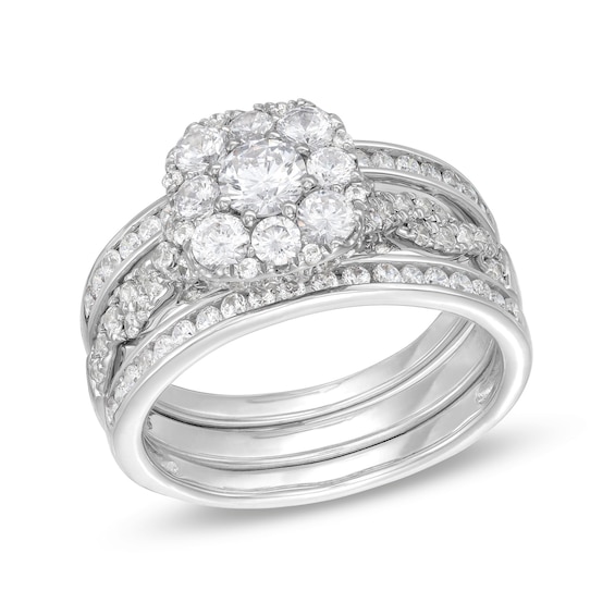1-1/2 CT. T.w. Cushion Multi-Diamond Twist Shank Three Piece Bridal Set in 10K White Gold