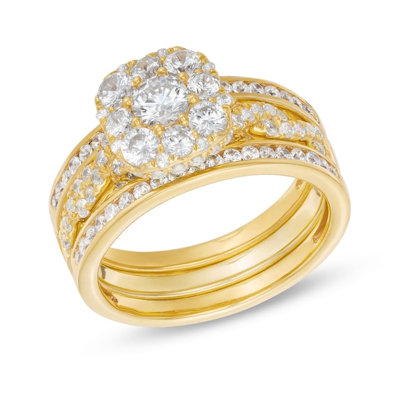 1-1/2 CT. T.w. Cushion Multi-Diamond Twist Shank Three Piece Bridal Set in 10K Gold